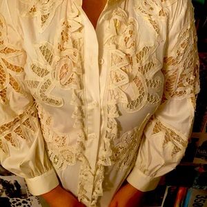 This is a Oscar de la Renta white lace blouse it has been worn several times